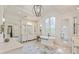 Luxurious bathroom with soaking tub, marble countertops, and custom cabinetry at 4874 Kettle River Pt, Suwanee, GA 30024