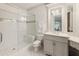 Bright bathroom featuring a glass shower, white subway tile, and vanity at 4874 Kettle River Pt, Suwanee, GA 30024