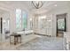 Luxurious bathroom with freestanding tub, large windows, and custom vanity at 4874 Kettle River Pt, Suwanee, GA 30024