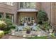 Charming outdoor patio with fire pit, surrounded by comfortable seating and lush landscaping, ideal for entertaining at 4874 Kettle River Pt, Suwanee, GA 30024