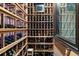 Temperature-controlled wine cellar with wooden racks, designed to store and showcase an extensive wine collection at 4874 Kettle River Pt, Suwanee, GA 30024