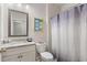 Clean bathroom with granite countertop, toilet and shower/tub combo at 113 Overlook Ridge Way, Canton, GA 30114
