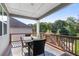 Relaxing deck with table and chairs, offering scenic views at 113 Overlook Ridge Way, Canton, GA 30114