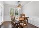 Bright dining room features a wood table with seating for six and a rustic chandelier at 113 Overlook Ridge Way, Canton, GA 30114