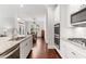 Modern kitchen with white cabinets, granite counters and island at 113 Overlook Ridge Way, Canton, GA 30114
