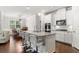 Modern kitchen with white cabinets, granite counters, and island at 113 Overlook Ridge Way, Canton, GA 30114