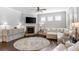Spacious living room with hardwood floors, fireplace, and large windows at 113 Overlook Ridge Way, Canton, GA 30114