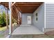 Concrete patio below a deck with stairs and exterior access at 113 Overlook Ridge Way, Canton, GA 30114