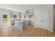 Modern kitchen with gray cabinets, granite counters and island at 11827 Rizvan Pl, Covington, GA 30014