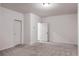 Bright basement room with neutral walls and carpet at 2709 Richmond Row Dr, Suwanee, GA 30024