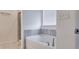 Main bathroom with soaking tub and shower at 2709 Richmond Row Dr, Suwanee, GA 30024