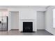 Modern fireplace with a black hearth and white mantel at 2709 Richmond Row Dr, Suwanee, GA 30024