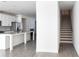 Modern kitchen with white cabinets, granite countertops, and stainless steel appliances at 2709 Richmond Row Dr, Suwanee, GA 30024