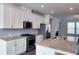 Modern kitchen with stainless steel appliances and granite countertops at 2709 Richmond Row Dr, Suwanee, GA 30024