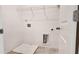 Laundry room with shelving and drain at 2709 Richmond Row Dr, Suwanee, GA 30024