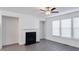Bright living room featuring a fireplace and wood-look floors at 2709 Richmond Row Dr, Suwanee, GA 30024