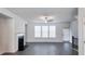 Bright living room with hardwood floors and fireplace at 2709 Richmond Row Dr, Suwanee, GA 30024