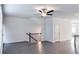 Open living room with a staircase and wood-look floors at 2709 Richmond Row Dr, Suwanee, GA 30024