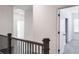 Upstairs hallway with access to bedrooms and bath at 2709 Richmond Row Dr, Suwanee, GA 30024