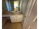 Small bathroom with single vanity and mirror at 4010 Peachtree Farms Rd, Rex, GA 30273