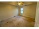 Large carpeted bedroom with window and ceiling fan at 4010 Peachtree Farms Rd, Rex, GA 30273