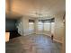 Kitchen dining area with herringbone flooring and bay window at 4010 Peachtree Farms Rd, Rex, GA 30273