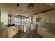 Modern kitchen with white cabinets, quartz countertops, and herringbone flooring at 4010 Peachtree Farms Rd, Rex, GA 30273
