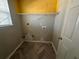 Laundry room with herringbone floor and shelving at 4010 Peachtree Farms Rd, Rex, GA 30273