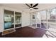 Cozy screened-in back porch with ceiling fan, string lights, and sliding glass doors to the interior at 2976 Bay Berry Sw Dr, Marietta, GA 30008