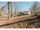 Exterior back view of the home, featuring a deck and wooded backyard at 2976 Bay Berry Sw Dr, Marietta, GA 30008