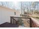 Back of home with wooden deck overlooking a partially wooded yard at 2976 Bay Berry Sw Dr, Marietta, GA 30008
