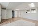 Large finished basement featuring wood-look floors, a window, and multiple entry points at 2976 Bay Berry Sw Dr, Marietta, GA 30008