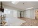 Bright finished basement with a brick fireplace, multiple doorways, and durable wood-look flooring at 2976 Bay Berry Sw Dr, Marietta, GA 30008