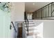 Bright entryway featuring staircase with iron railing and wood-look flooring at 2976 Bay Berry Sw Dr, Marietta, GA 30008