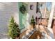 Close-up of front door and porch with decorative plants and a welcome mat at 2976 Bay Berry Sw Dr, Marietta, GA 30008