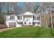 Inviting brick home with attached garage and a pristine lawn, complemented by a welcoming front entrance at 2976 Bay Berry Sw Dr, Marietta, GA 30008
