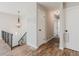 Hallway with multiple doors and wood-look flooring, illuminated by a hanging light fixture at 2976 Bay Berry Sw Dr, Marietta, GA 30008