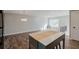 Bright and spacious living room featuring wood flooring, a modern chandelier, and natural light at 2976 Bay Berry Sw Dr, Marietta, GA 30008