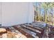 A stone patio area alongside a white brick house, awaiting personalization and outdoor enjoyment at 2976 Bay Berry Sw Dr, Marietta, GA 30008