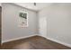 Simple bedroom with hardwood floors and a barn door at 199 Racine Sw St, Atlanta, GA 30314