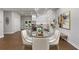 Open-concept dining area with glass table, chairs, and a view into a modern kitchen and backyard at 199 Racine Sw St, Atlanta, GA 30314