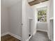 Bright hallway with wood floors and attic access at 199 Racine Sw St, Atlanta, GA 30314