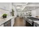 Open-concept kitchen with granite countertops and seamless flow to dining and living areas at 199 Racine Sw St, Atlanta, GA 30314