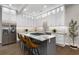Modern kitchen with stainless steel appliances, granite countertops, and island with barstool seating at 199 Racine Sw St, Atlanta, GA 30314