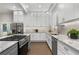 Well-equipped kitchen with stainless steel appliances, granite countertops, and ample cabinet space at 199 Racine Sw St, Atlanta, GA 30314