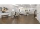 Spacious living room with dark hardwood floors, a dining area, and a modern sofa at 199 Racine Sw St, Atlanta, GA 30314