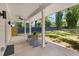 Covered patio area with outdoor seating overlooks a grassy yard at 199 Racine Sw St, Atlanta, GA 30314