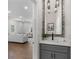 Stylish powder room with modern vanity, marble-framed mirror, and access to the living room at 199 Racine Sw St, Atlanta, GA 30314