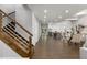 Modern wooden staircase with stainless steel railing at 199 Racine Sw St, Atlanta, GA 30314