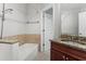 Bathroom with tub and granite vanity at 2479 Peachtree Rd # 101, Atlanta, GA 30324